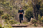 Forest, running and woman of fitness, body training and cardio wellness, outdoor challenge or hiking in nature. Runner, athlete or african sports person, cardio workout and marathon exercise in woods