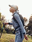 Hiking, fitness and black woman in nature walking for exercise, cardio workout and adventure in woods. Sports, endurance and female person trekking in forest for healthy body, wellness and freedom