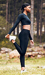 Workout, stretching legs and black woman in nature for exercise, training and fitness in forest. Sports, woods and profile of female person stretch body for warm up, running performance and wellness