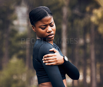 Buy stock photo Shoulder, pain and sports woman outdoor for health risk, bruise and hands on wound in park. Fitness, black female athlete and arm injury of muscle, joint problem and first aid for exercise accident