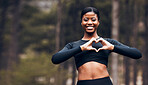 Heart hand, black woman and fitness in nature with exercise and fitness with love gesture. Sport, female person and support outdoor by the trees after a run with romance sign from a workout in park 