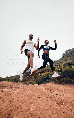 Buy stock photo Running, jump and couple in mountain with fitness workout and training on a race and marathon. Runner, young people and road on a exercise challenge outdoor with sport cardio performance in nature  