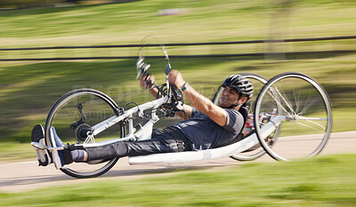 Buy stock photo Cycling, fitness and fast with man and handcycle in nature for training, sports and challenge. Exercise, workout and cardio with person with a disability in park for motion blur, marathon and health
