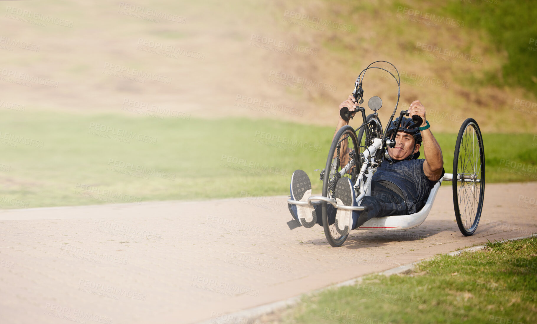Buy stock photo Cycling, nature and speed, man with disability training for competition with motivation and exercise on bike. Motion, workout and person on fast recumbent bicycle for outdoor race, space and mockup.