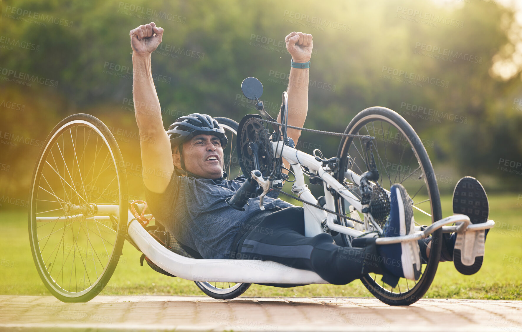 Buy stock photo Cycling, winning and happy man with disability, competition training with success and exercise champion on bike. Happiness, workout and celebration, person on recumbent bicycle and winner of race.