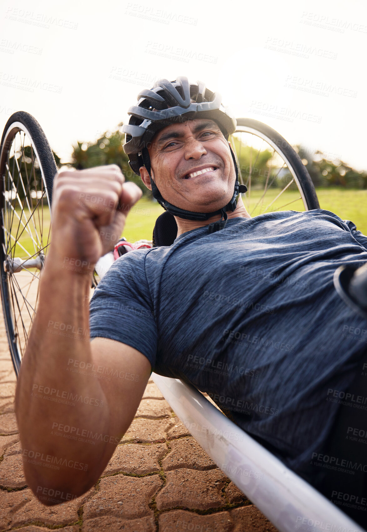 Buy stock photo Portrait, cycling and a winner man with disability in celebration of success in a sports competition. Exercise, smile and motivation with a young male cyclist athlete on a custom bike for training