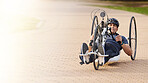 Man with disability, handbike and outdoor bicycle for sports, race or exercise power with flare of mockup space. Fitness, male athlete with paraplegia and cycling in competition, challenge or contest