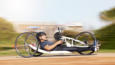 Buy stock photo Cycling, fitness and speed with man and handcycle in nature for training, sports and challenge. Exercise, workout and motion blur with person with a disability in park for cardio and health