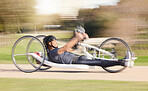 Cycling, speed and man with disability in race training for competition with action, motivation and exercise on bike. Energy, workout and person on recumbent bicycle on fast outdoor track challenge.