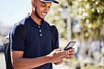 Technology, man with smartphone and in city streets for social media. Online communication or connectivity, texting conversation or happy and male person with cellphone for networking outdoors