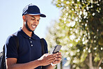 Technology, man with smartphone and in city streets for connectivity. Online communication or social media, texting networking or happy and male person with cellphone for conversation outdoors