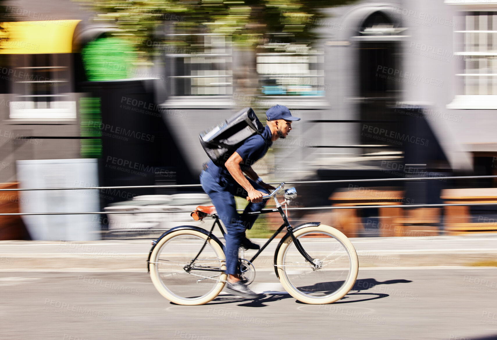 Buy stock photo Delivery man, bicycle and motion blur in city for fast logistics, quick distribution service and order. Courier, guy or travel with speed on bike, cycle and transportation for package in urban street