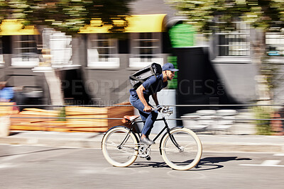 Delivery, man or motion blur on bike in city for quick logistics, service or fast food order. Courier, postman or travel for speed on bicycle transportation with parcel, package or trip in urban road