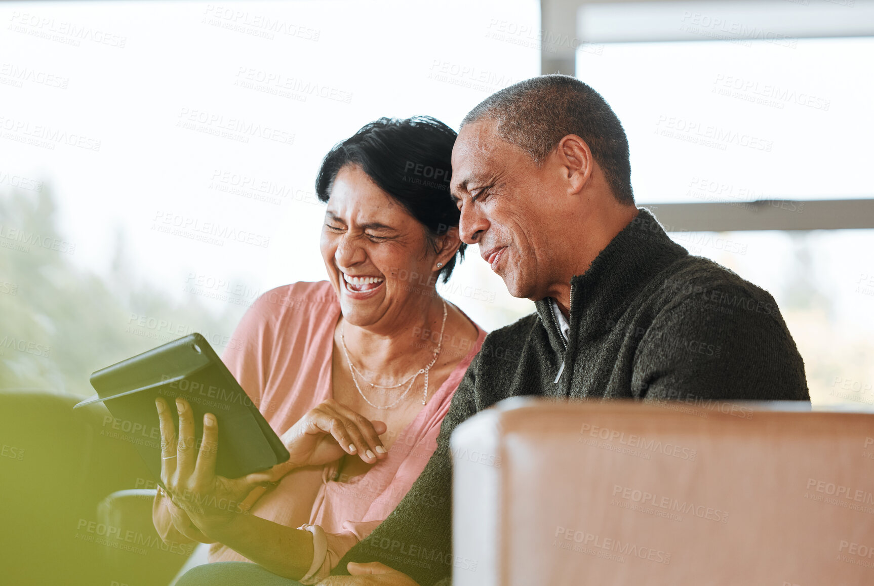 Buy stock photo Relax, funny and search with old couple and tablet on sofa for communication, social media or networking. Technology, contact and online with senior man and woman in living room at home for laugh