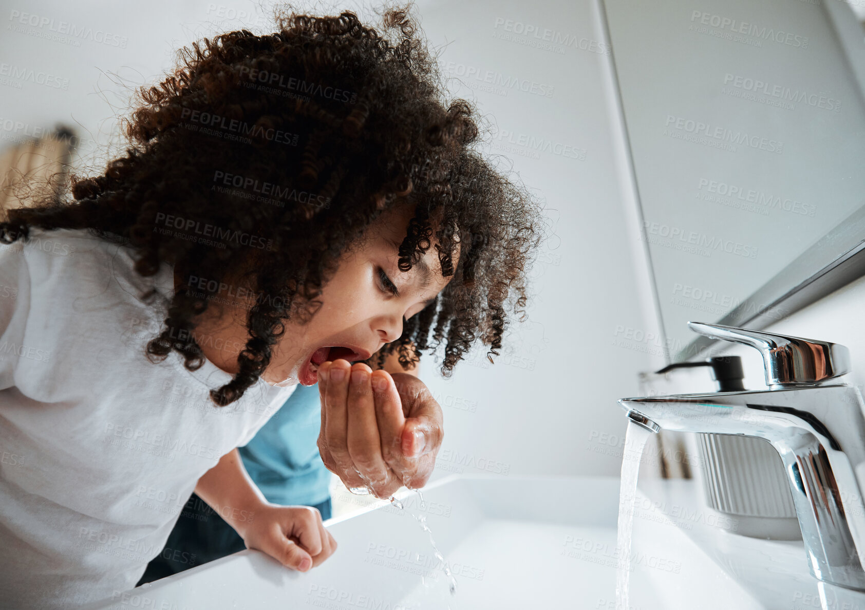 Buy stock photo Child, dental health and water to rinse mouth with hand of a parent at a bathroom basin for wellness. African girl kid learning about brushing teeth for morning routine at home with a parent for help