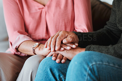 Buy stock photo Closeup, couple and holding hands to forgive, love and care with empathy at home. Life partner, helping hand and support of man, woman and hope for kindness, trust or gratitude for therapy of anxiety