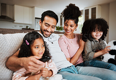 Buy stock photo Mom, dad and happy kids on couch, watching tv and family bonding together in living room. Smile, happiness and parents relax with children on sofa, streaming television show subscription or movies.