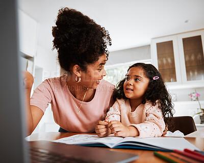 Buy stock photo Laptop, mother and daughter with book, homework and happy, elearning and study at desk. Kid, mama and education with computer, notebook and teaching for development, notes and happy in family home