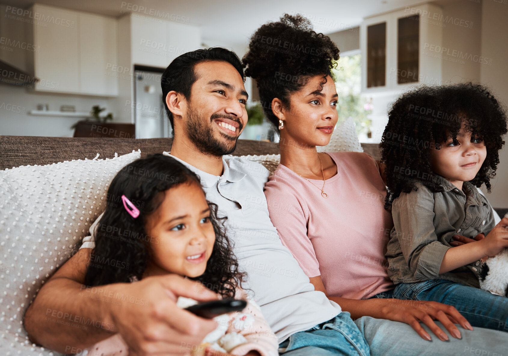 Buy stock photo Mother, father and children on couch, watching tv and happy family bonding together in living room. Remote, happiness and parents relax with kids on sofa, streaming television show or movies in home.