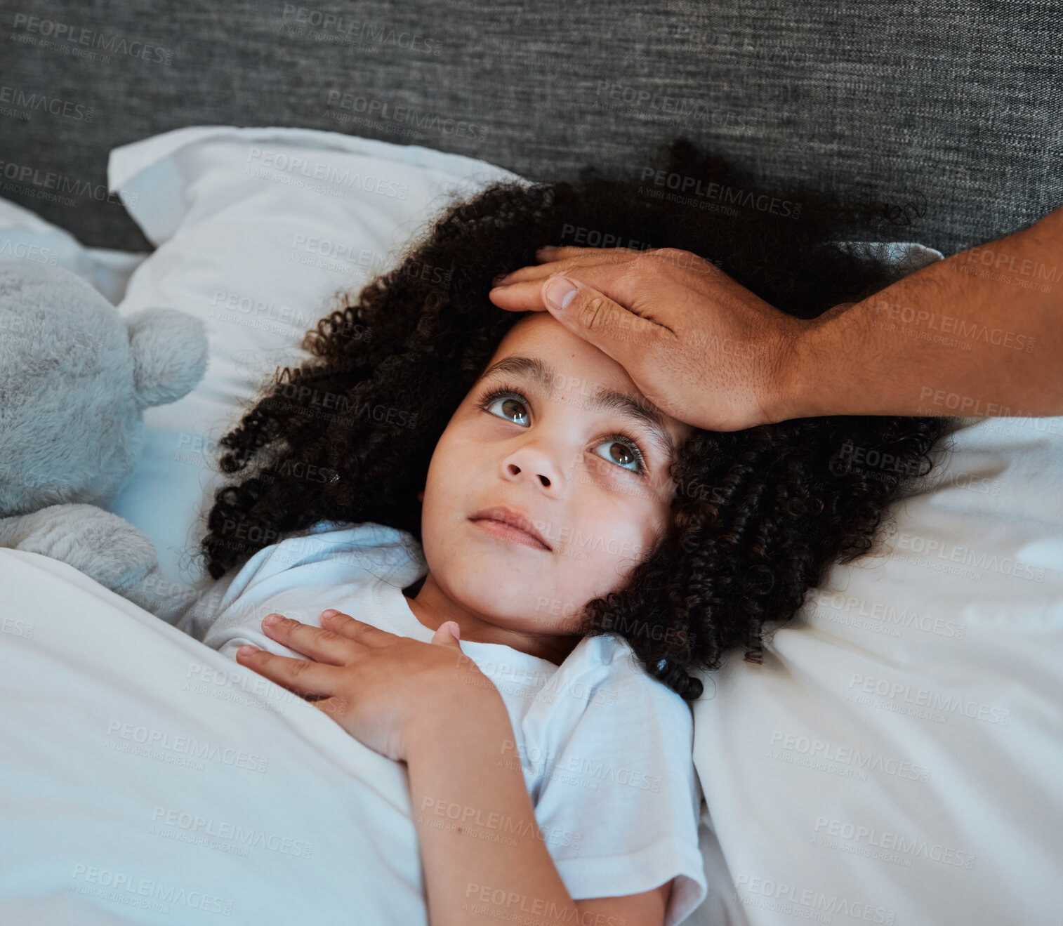 Buy stock photo Sick, fever and girl child in bed for rest to recover from flu, cold or allergies at her home. Illness, tired and hand of father checking the temperature of his daughter in her bedroom at their house