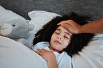 Sick, fever and kid sleeping in bed for rest to recover from flu, cold or allergies at her home. Illness, tired and hand of father checking temperature of his daughter in her bedroom at their house.