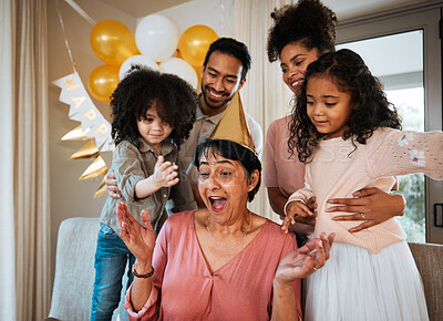 Buy stock photo Birthday, surprise and children with excited grandmother at party for event, celebration and social gathering. Happy family, celebrate and shocked grandma with parents and kids for presents at home