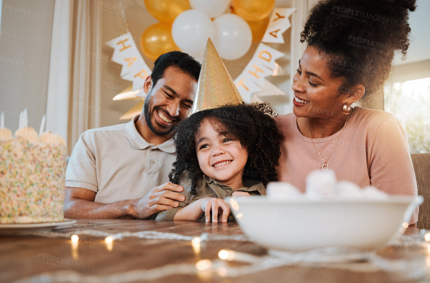 Buy stock photo Birthday, party and parents with cake for child in living room for event, celebration and social gathering. Happy family, surprise and kid with dessert, snacks and sweet treats with presents at home