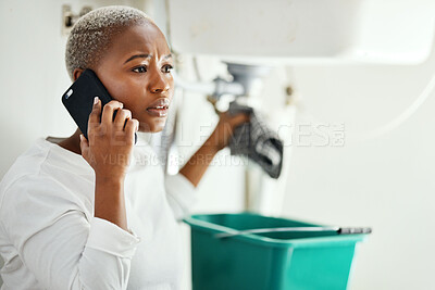 Buy stock photo Phone call for plumbing service, woman in bathroom and help from expert contractor to fix leak. Stress, African person on cellphone and problem with pipes in home, professional advice for maintenance