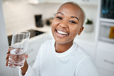 Buy stock photo Portrait, glass and black woman drinking water, smile and health with joy, nutrition and laughing. Face, female person or happy girl in her kitchen, liquid and home with happiness, wellness and detox