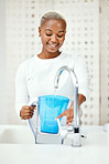 Water, filter and black woman at tap with jug for liquid purification, cold hydration and cooling bottle at home. Happy female person at faucet for pure aqua, clean treatment and pitcher for drink