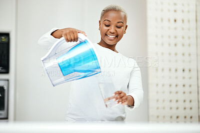 Buy stock photo Black woman, pitcher and glass with water filter for clean and fresh purification at home. Happy female person pouring healthy aqua beverage for nutrition, drinking and cold filtration jug in kitchen