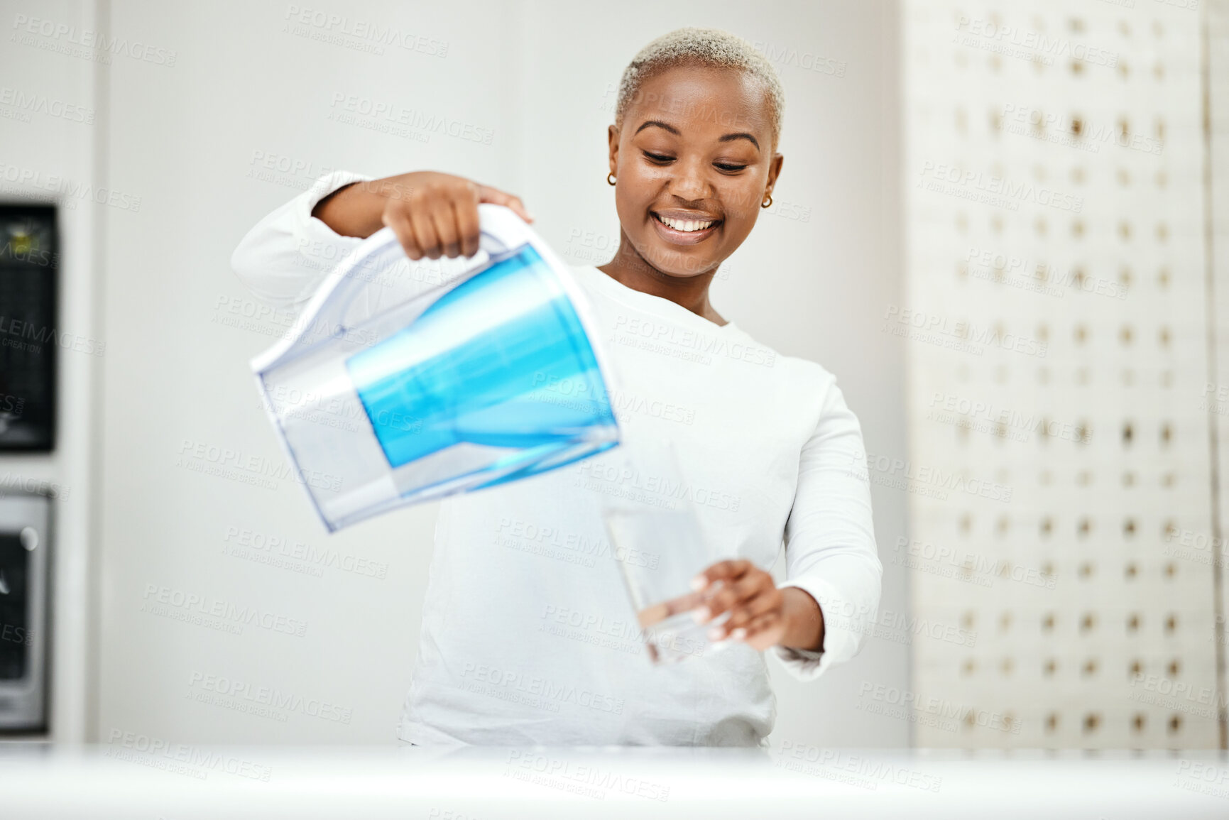 Buy stock photo Black woman, pitcher and glass with water filter for clean and fresh purification at home. Happy female person pouring healthy aqua beverage for nutrition, drinking and cold filtration jug in kitchen