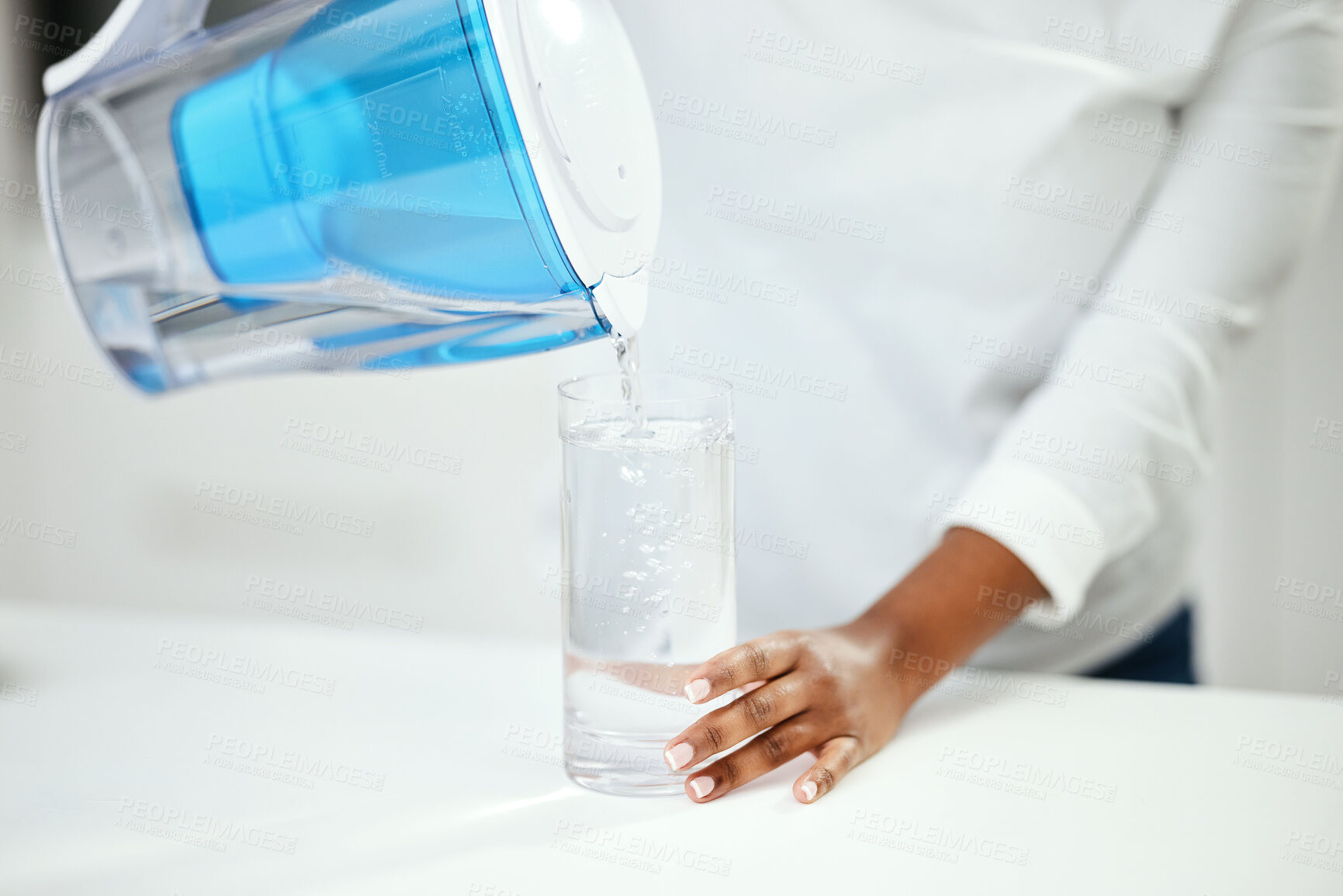 Buy stock photo Hands, person and pitcher of filter water, glass and liquid hydration for purification at home. Closeup, thirsty woman and pouring healthy aqua beverage for nutrition, drinking and clean filtration