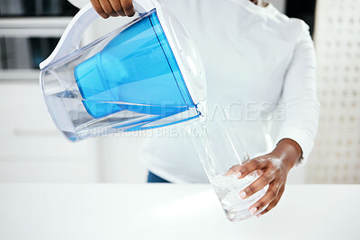 Buy stock photo Hands, jug and glass of filter water to refresh with pure liquid hydration at home. Closeup, thirsty person and pouring healthy aqua beverage in container for nutrition, drinking and cold filtration