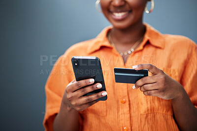 Buy stock photo African woman, credit card and phone in studio with e commerce, digital payment or smile by background. Girl, smartphone and fintech with online shopping, bills and cybersecurity with typing password