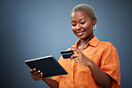 African woman, credit card and tablet in studio for e commerce, digital payment or smile by background. Girl, touchscreen and fintech with online shopping, bills or cybersecurity with typing password