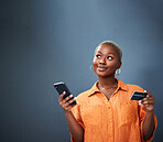 Thinking, ecommerce and credit card with a black woman using her phone in studio on a gray background. Mobile, online shopping and finance payment with a female shopper searching for a deal or sale