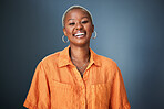 Smile, laugh and portrait of black woman laughing in studio at silly, joke or funny against a gradient grey background. Happy, laugh and face of African female with positive attitude or good vibes