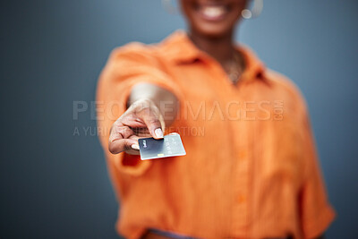 Buy stock photo Black Woman, hand and payment on credit card is paying a bill in studio background for success. Finance, banking and girl with plastic for investment or budget or hand showing purchase method.