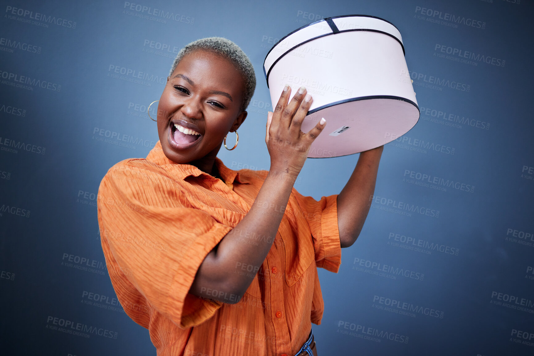 Buy stock photo Black woman, excited with gift box and celebration, special event and happiness isolated on blue background. African, female person with present and birthday, party and happy with surprise in studio