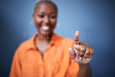 Buy stock photo Finger, security and black woman user in studio on blue background for internet browsing or access to information. Future, hand and app with fingerprint biometrics of a female person on an interface