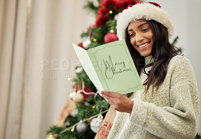 Buy stock photo Happy woman reading Christmas card, letter or note in home living room in winter holiday celebration. Smile, festive or Indian girl with emotional xmas greeting message, wishes and kindness in house