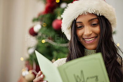 Buy stock photo Happy woman reading Christmas card, note or message in home living room in winter holiday celebration. Smile, festive or Indian girl with emotional xmas greeting letter, wishes or kind gift in house