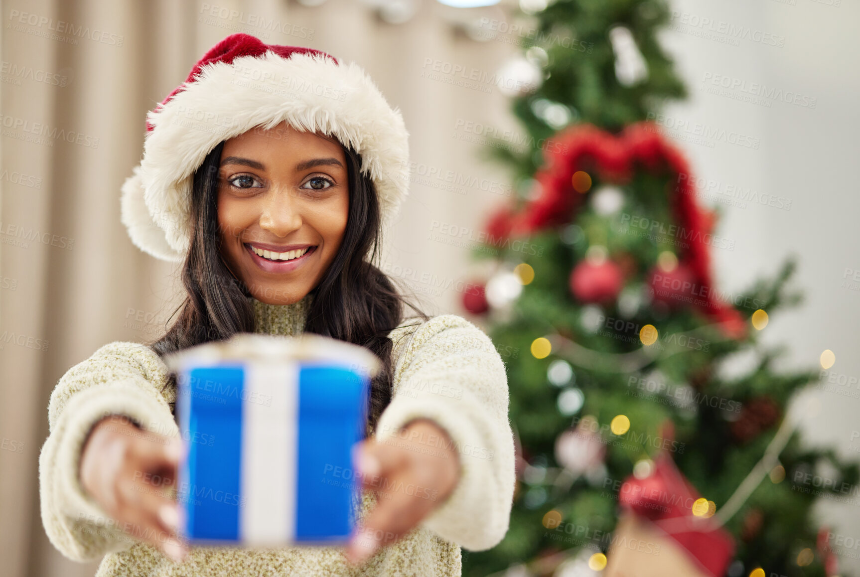 Buy stock photo Happy woman, Christmas and gift, celebrate holiday with happiness and smile in portrait. Special event, blue box with ribbon and female person at home giving a xmas present, package and festive