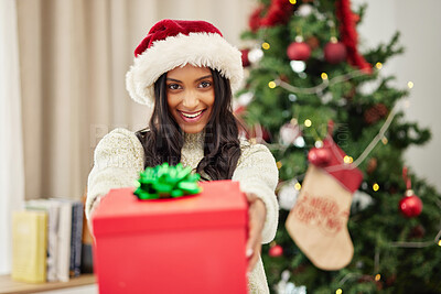 Buy stock photo Woman giving gift, Christmas and smile in portrait, celebrate holiday with happiness and wrapped box with ribbon. Special event, female person at home with present and package, festive and xmas