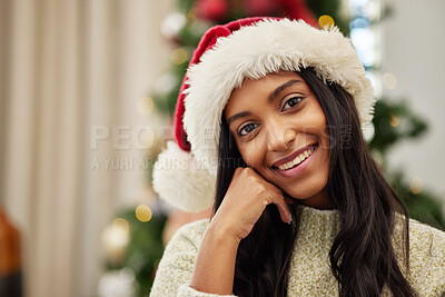 Buy stock photo Happy woman, portrait and Christmas hat for celebration, festive season or gift giving time at home. Face of female person with smile in relax for holiday, weekend or December party by tree in house