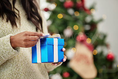 Buy stock photo Closeup, hands and woman with a gift, Christmas and box with a package, living room and celebration. Zoom, female person or girl with a Xmas present, festive season and product with holiday and party