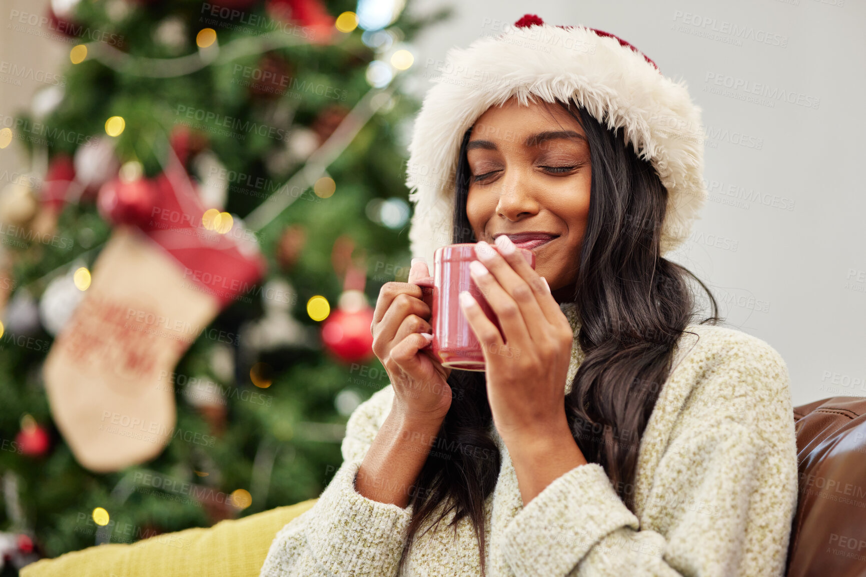 Buy stock photo Christmas, smile or happy woman with coffee in home on holiday or vacation break with a warm beverage. Cold winter, egg nog or cozy Indian girl drinking cup of tea or hot chocolate to relax at home