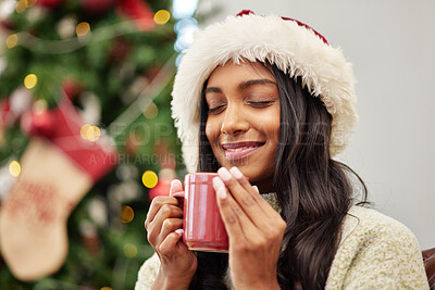 Buy stock photo Christmas, happy woman and coffee on home sofa with a smile while thinking of memory. Face of Indian female person with a hot chocolate or tea cup to relax for festive holiday, season or celebration