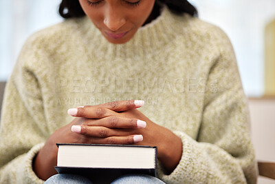 Buy stock photo Bible, hands and woman praying for help, faith or gratitude to God, praise and humble in her home. Jesus, worship and lady person in prayer for religious, hope or trust, Christian and spiritual guide